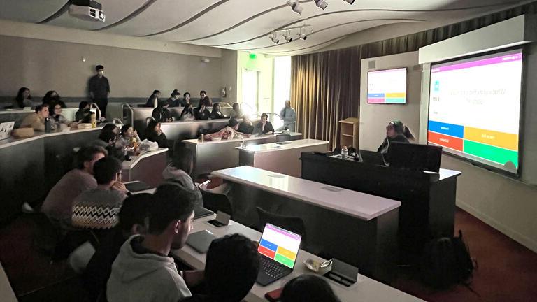 Students watch a presentation in a classroom