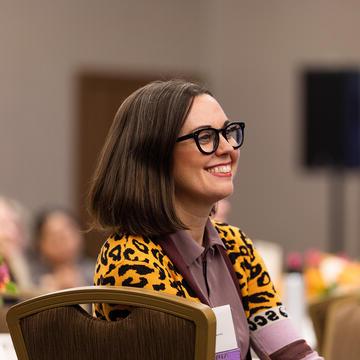 woman 笑ing during an event