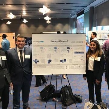 USF Students Pose with Winning Poster